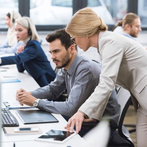 two people having a meeting within an office.